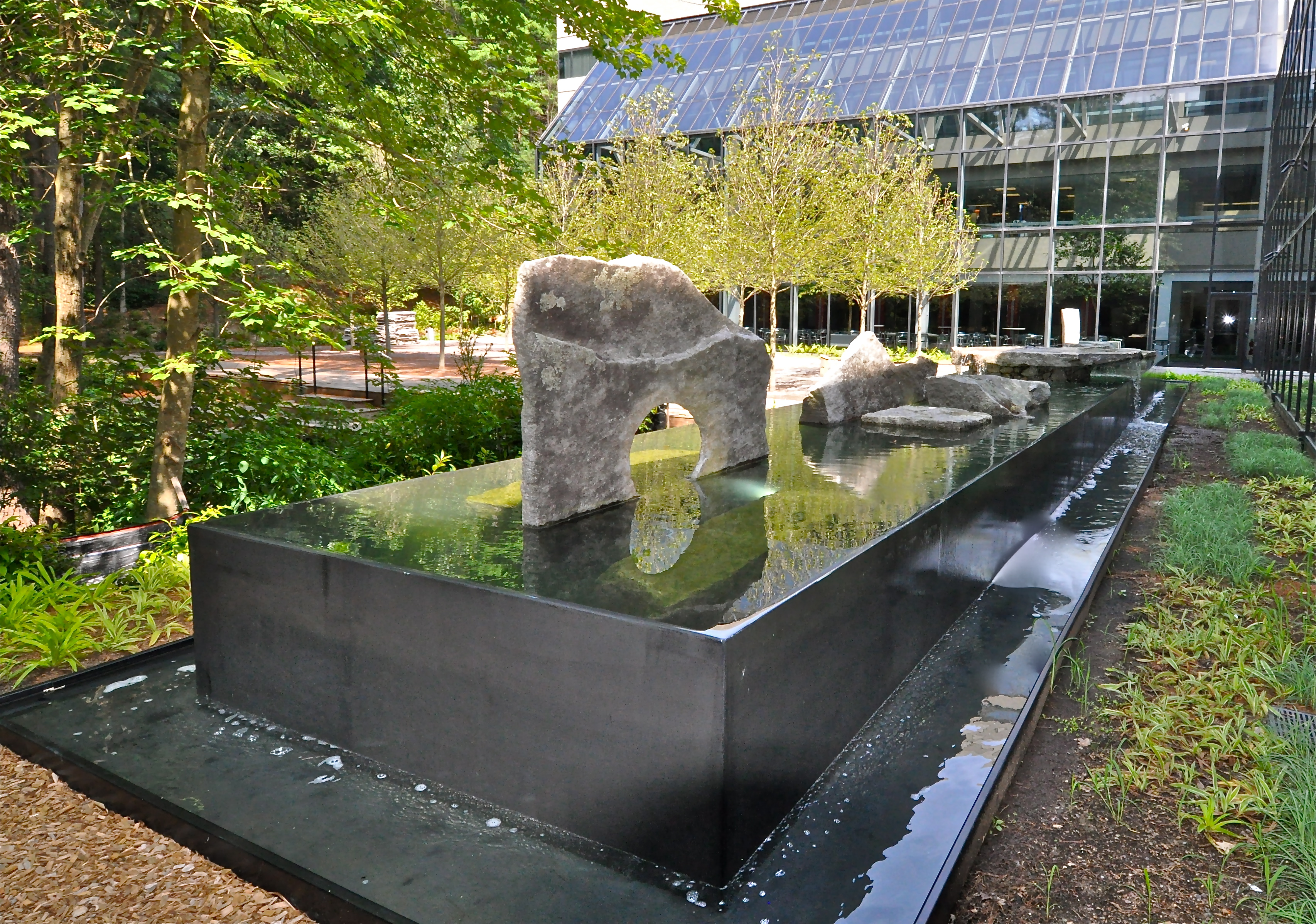 Negative edge water feature: Oracle: Bedford MA. Design by Thomas Wirth Associates. Architectural Stones by Lew French.